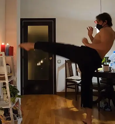 Training martial arts kicks at home by extinguishing candles, focusing on precision, speed, and control.