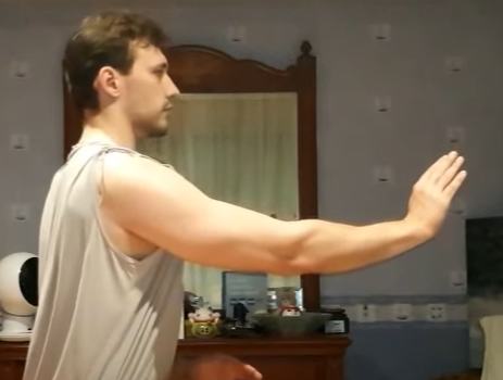 Practicing flowing movements in a living room